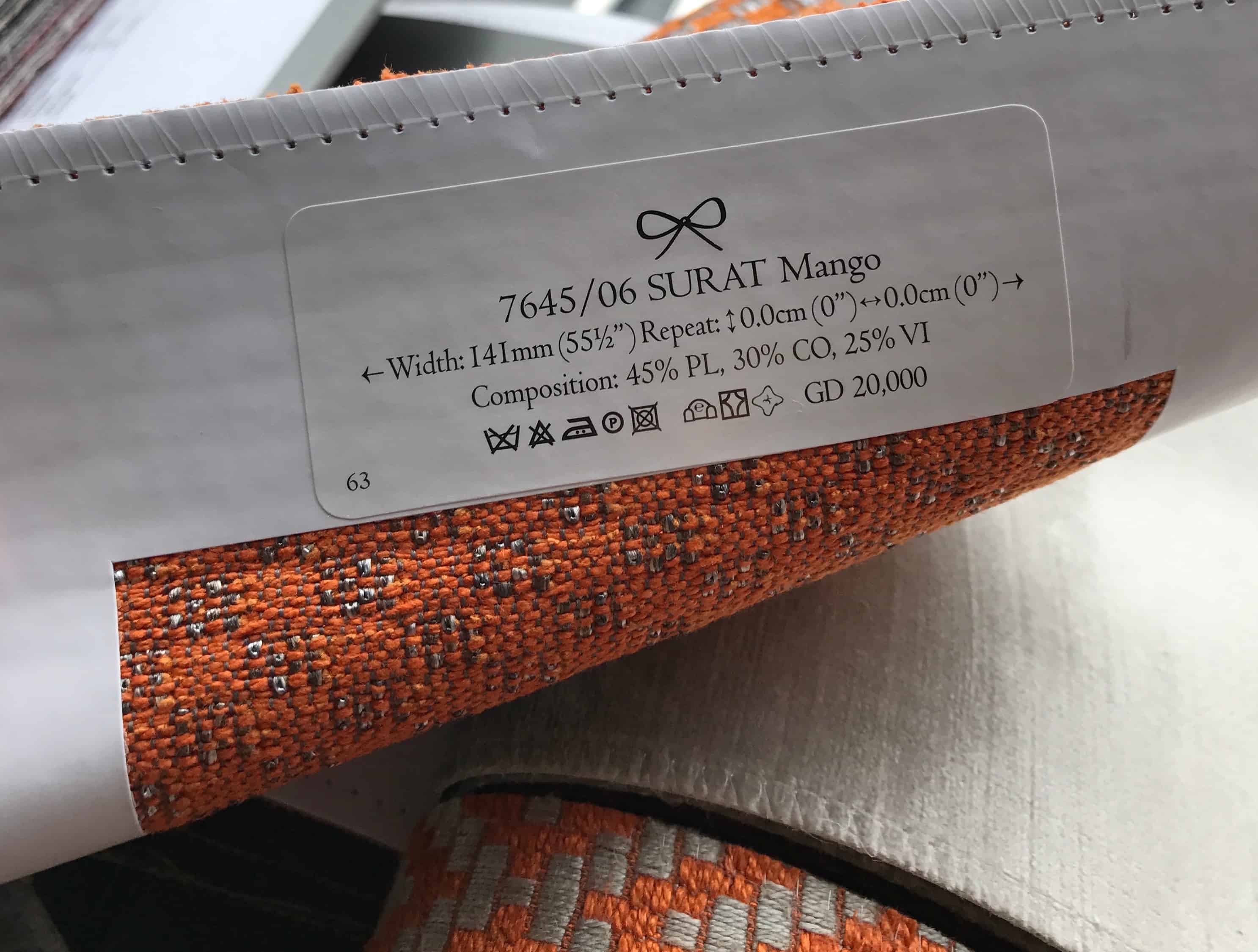 What defines an upholstery fabric